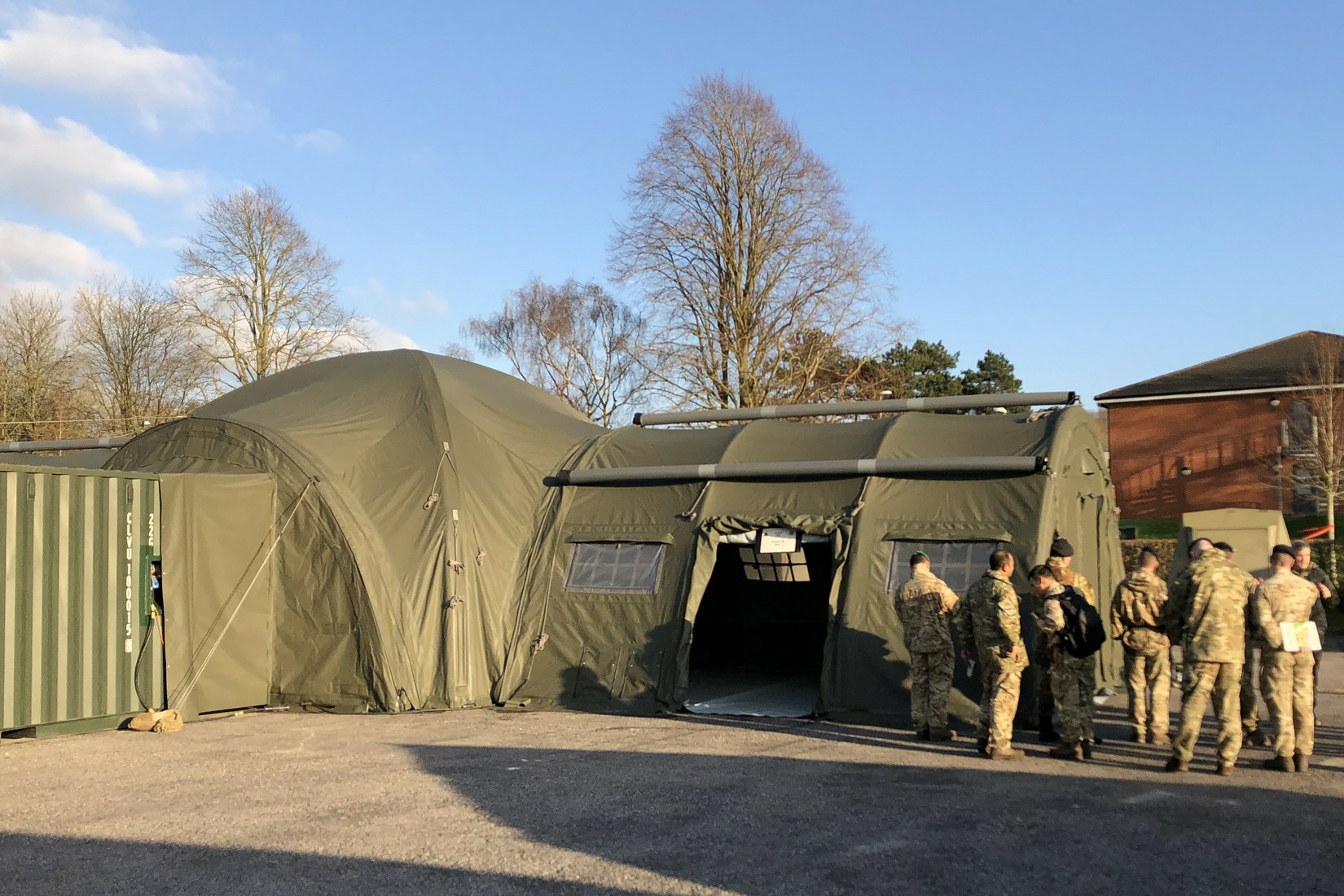 NIXUS PRO X Command Post is made up of 4 PRO tents arranged in an X shape around an interconnecting module